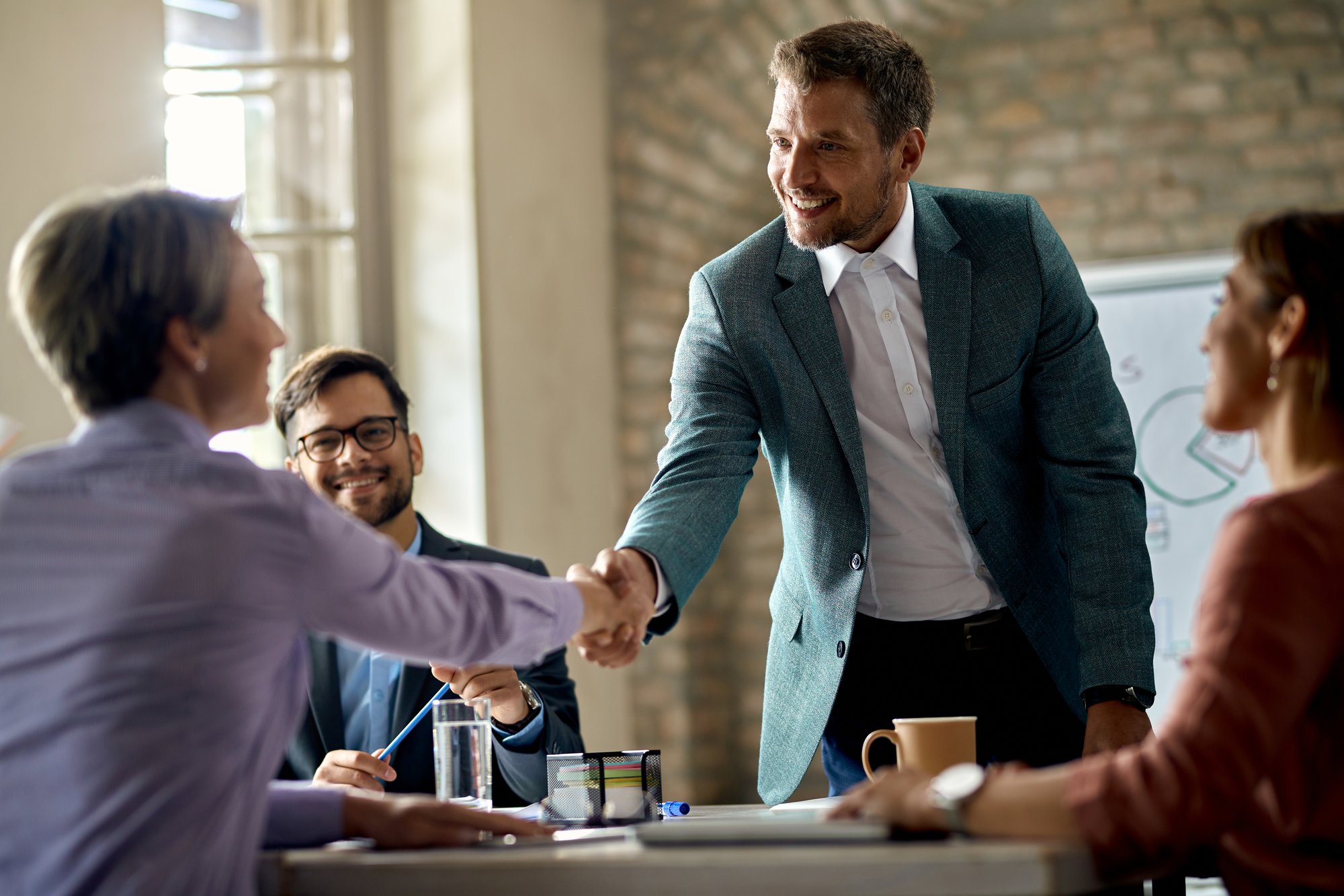 <a href="https://www.freepik.com/free-photo/business-coworkers-shaking-hands-meeting-office-focus-is-businessman_26390769.htm#fromView=search&page=1&position=1&uuid=6161d9aa-d8c2-428c-a068-56e55b728eea">Image by Drazen Zigic on Freepik</a>